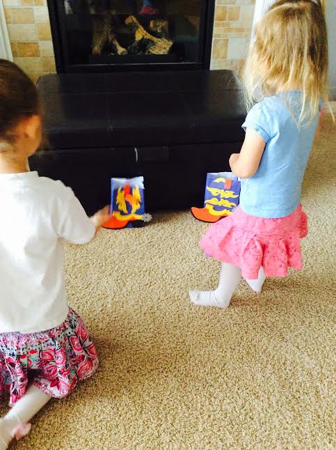 Curiosity Box kids subscription May 2016 review cowboy boot spur toss game kid playing