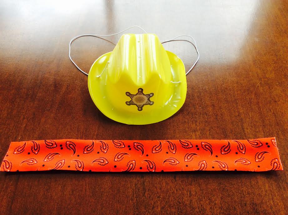 Curiosity Box kids subscription May 2016 review kids plastic toy cownboy hat slap wrist bracelet